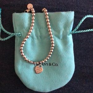 “Please return to Tiffany & Co.” bracelet.